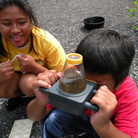 students studying water samples