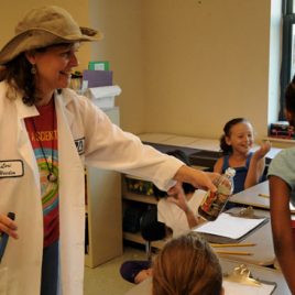 UMass Lowell Professor Lori Weeden volunteers with Lowell youth to share her water quality expertise.
