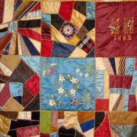 A 'crazy quilt' from 1845 hanging in the Spalding House (photo courtesy of Barbara Poole)