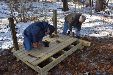 Corporate volunteers from Constellation, an Exelon Company, constructing a viewing platform.