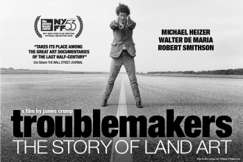 man standing in the middle of a road with hands in front outstretched "Troublemakers" the story of land art - movie poster
