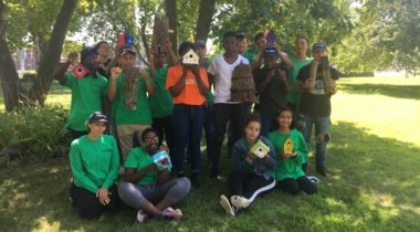 teens from Spindle city corp hold up homemade bridhouses and bat houses