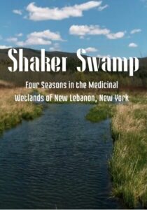 Poster for 'Shaker Swamp: Four Seasons in the Medicinal Wetlands of New Lebanon, New York' featuring a waterway and grassy banks.